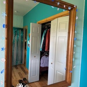 Brown Wooden Framed Mirror with Blue Accents